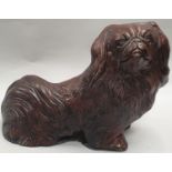 Pekingese dog figure.