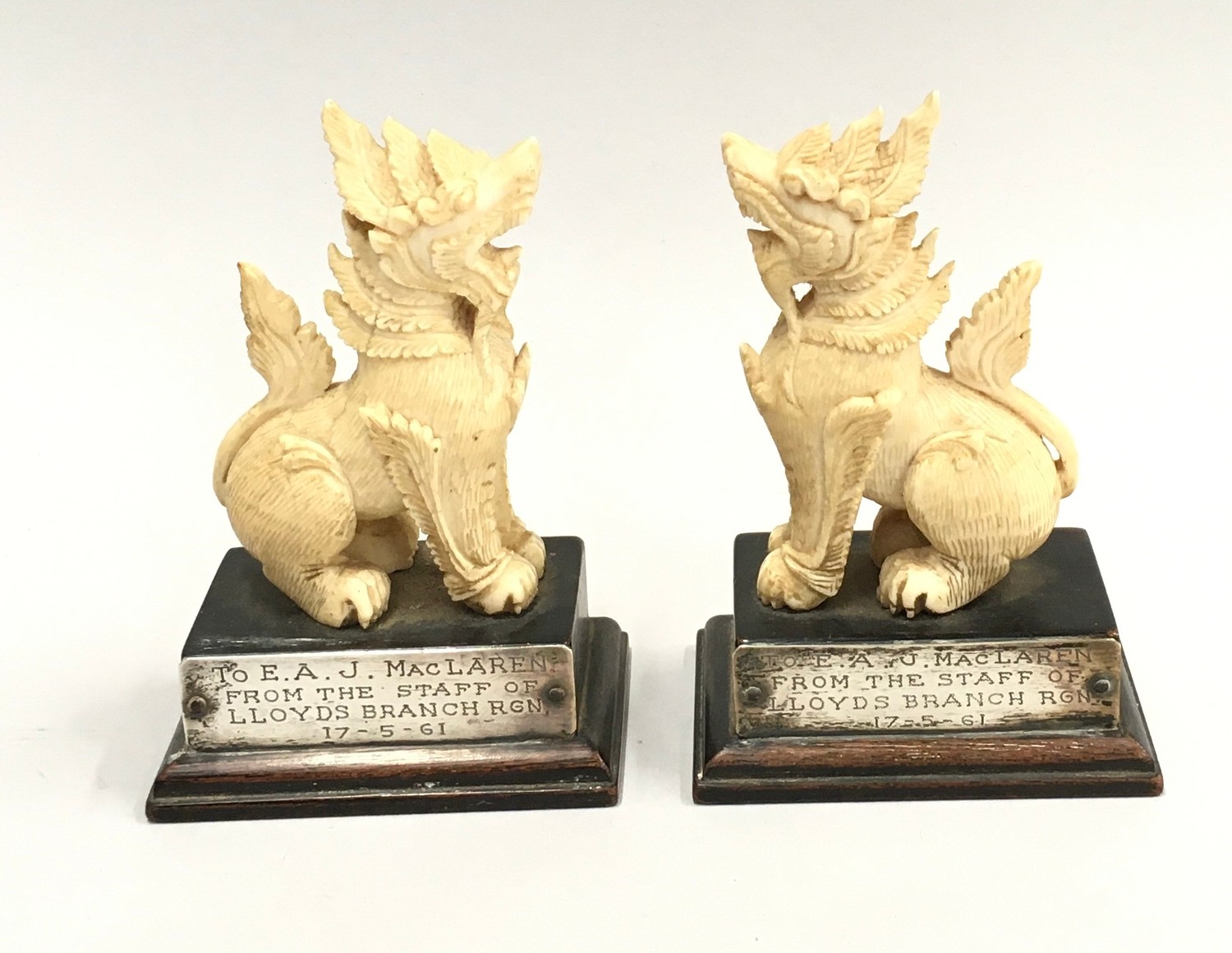 Pair oriental ivory Foo dogs with silver metal inscribed plates