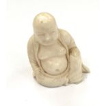 Small carved netsuke of a Buddha signed at base