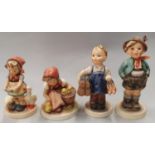 Four Hummel Goebel figures.