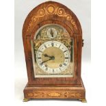 Edwardian in laid dome shape striking mantle clock,with brass face on brass feet and side carrying
