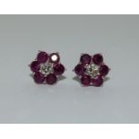 Pair of ruby and diamond earrings.