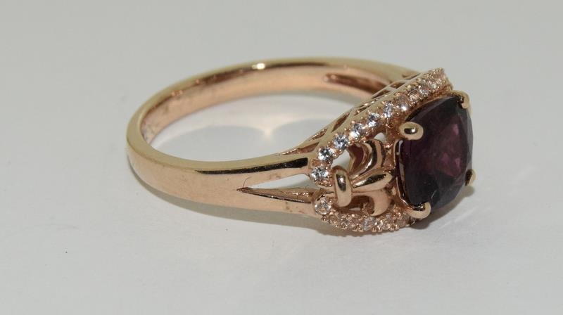 A 14ct rose gold garnet and white sapphire dress ring. - Image 5 of 6