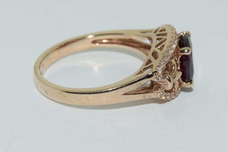 A 14ct rose gold garnet and white sapphire dress ring. - Image 2 of 6