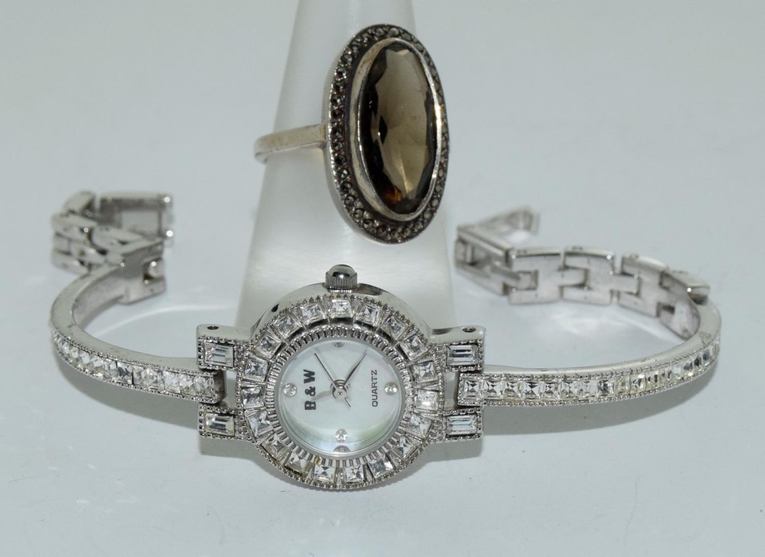 Silver and marcasite smokie quarts ring and a Butler and Wilson cocktail watch