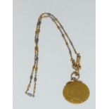 22ct gold 1790 half guinea mounted on a gold mount with an 18ct gold and platinum chain