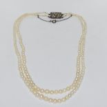 Art Deco double strand of cultured salt water pearls with silver paste clasp.