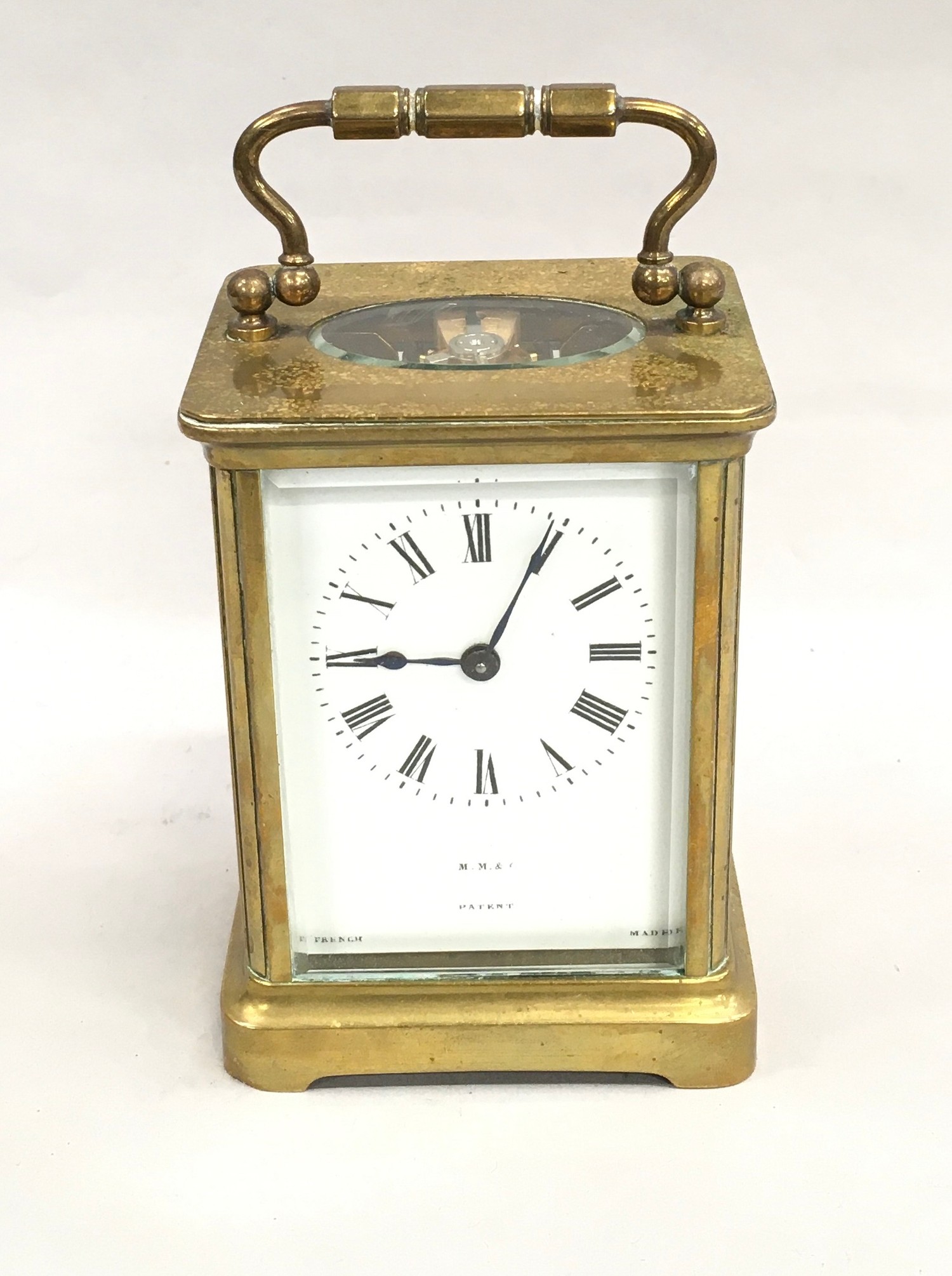Brass cased carriage clock with key marked M.M.C France working