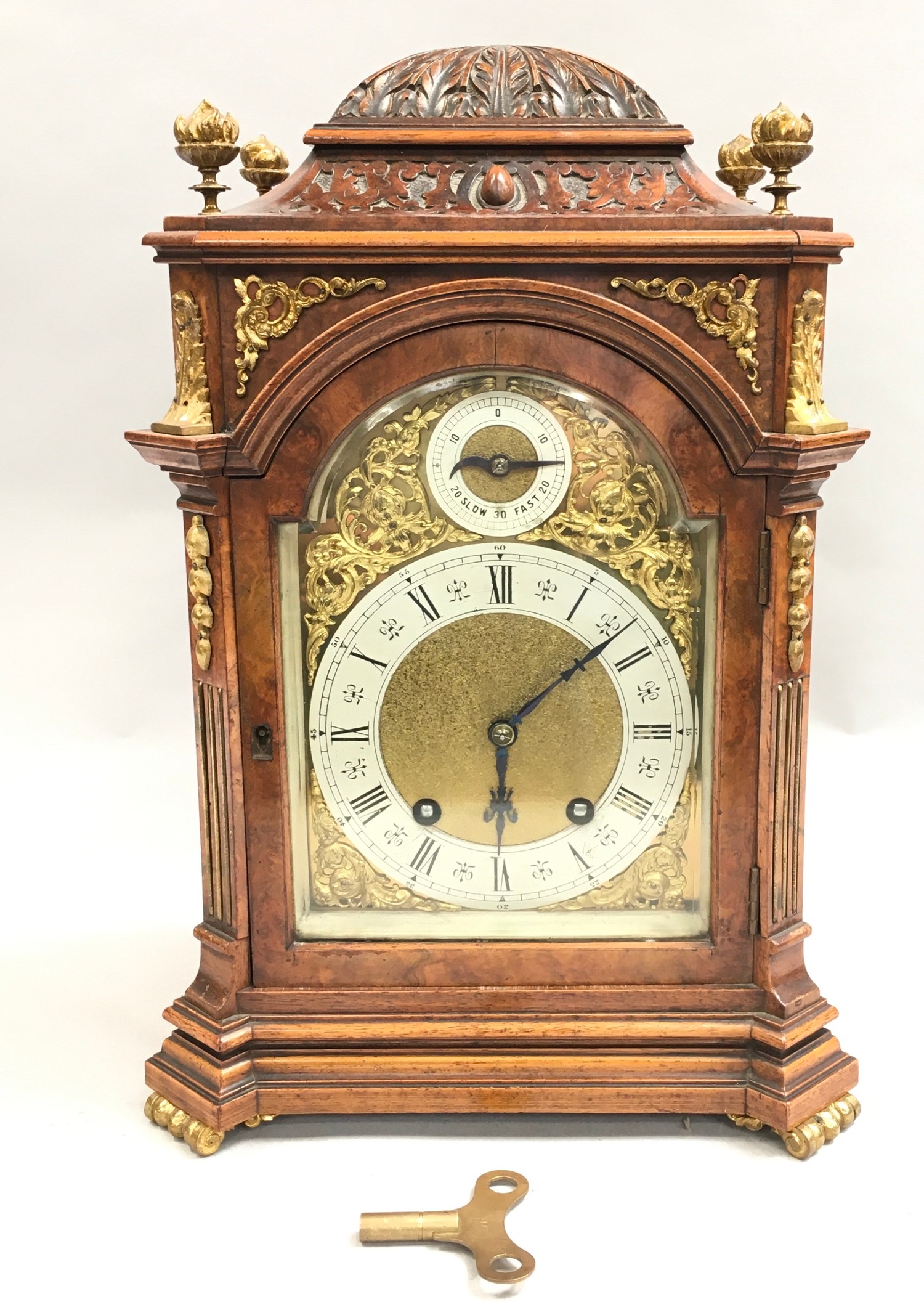 Walnut ormalu mounted striking bracket clock on brass feet with brass dial ,manufactured by