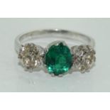 An 18ct white gold three stone emerald and diamond ring of 2 ct approx.size M