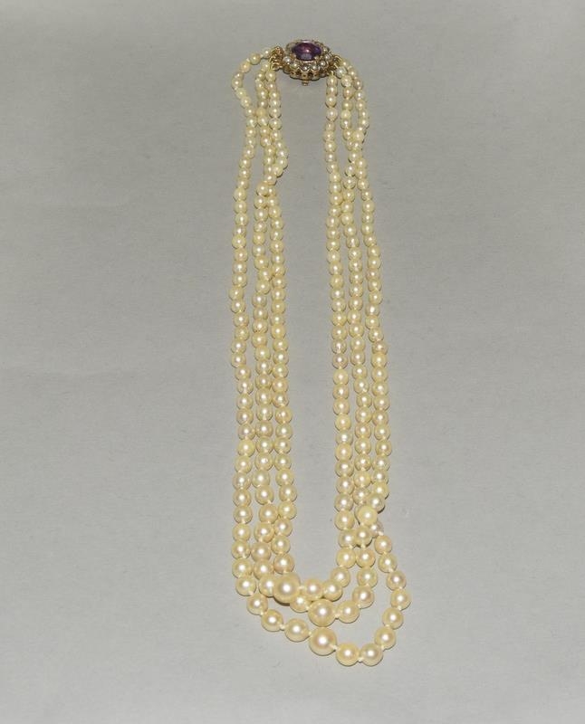 Triple strand Cultured Pearls Amethyst Seed Pearls.set with a gold and amethyst clasp