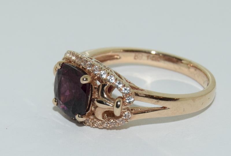 A 14ct rose gold garnet and white sapphire dress ring. - Image 4 of 6