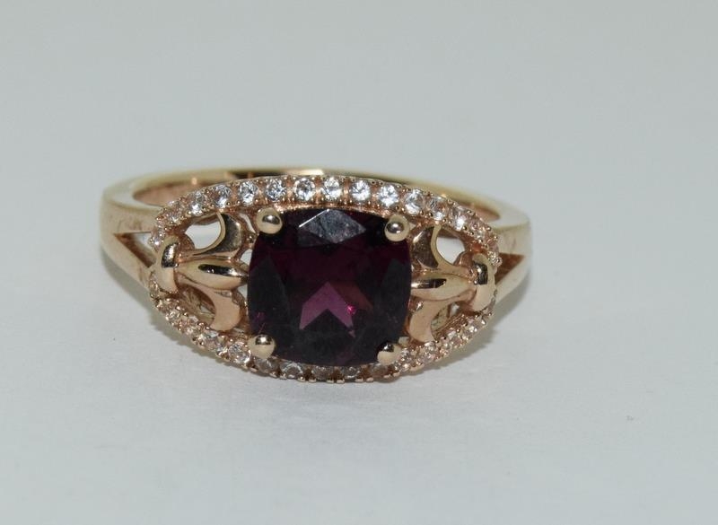 A 14ct rose gold garnet and white sapphire dress ring. - Image 6 of 6