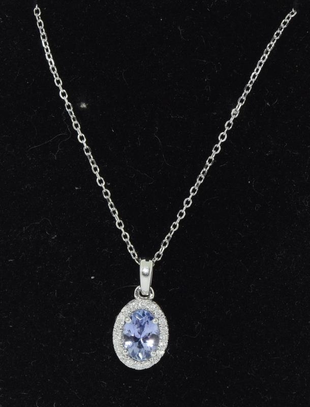An 18ct white gold Tanzanite and Diamond pendant necklace of 90 points Approx.