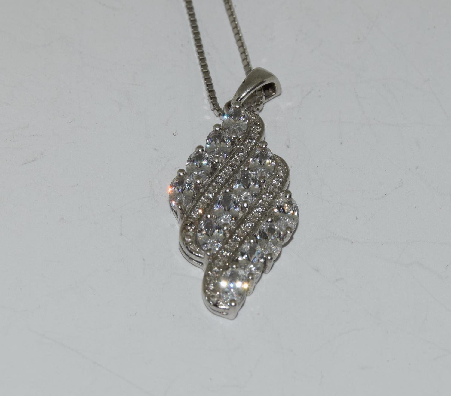 Glittering CZ 925 silver pendant.