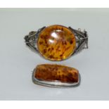 Amber silver set bracelet/brooch.