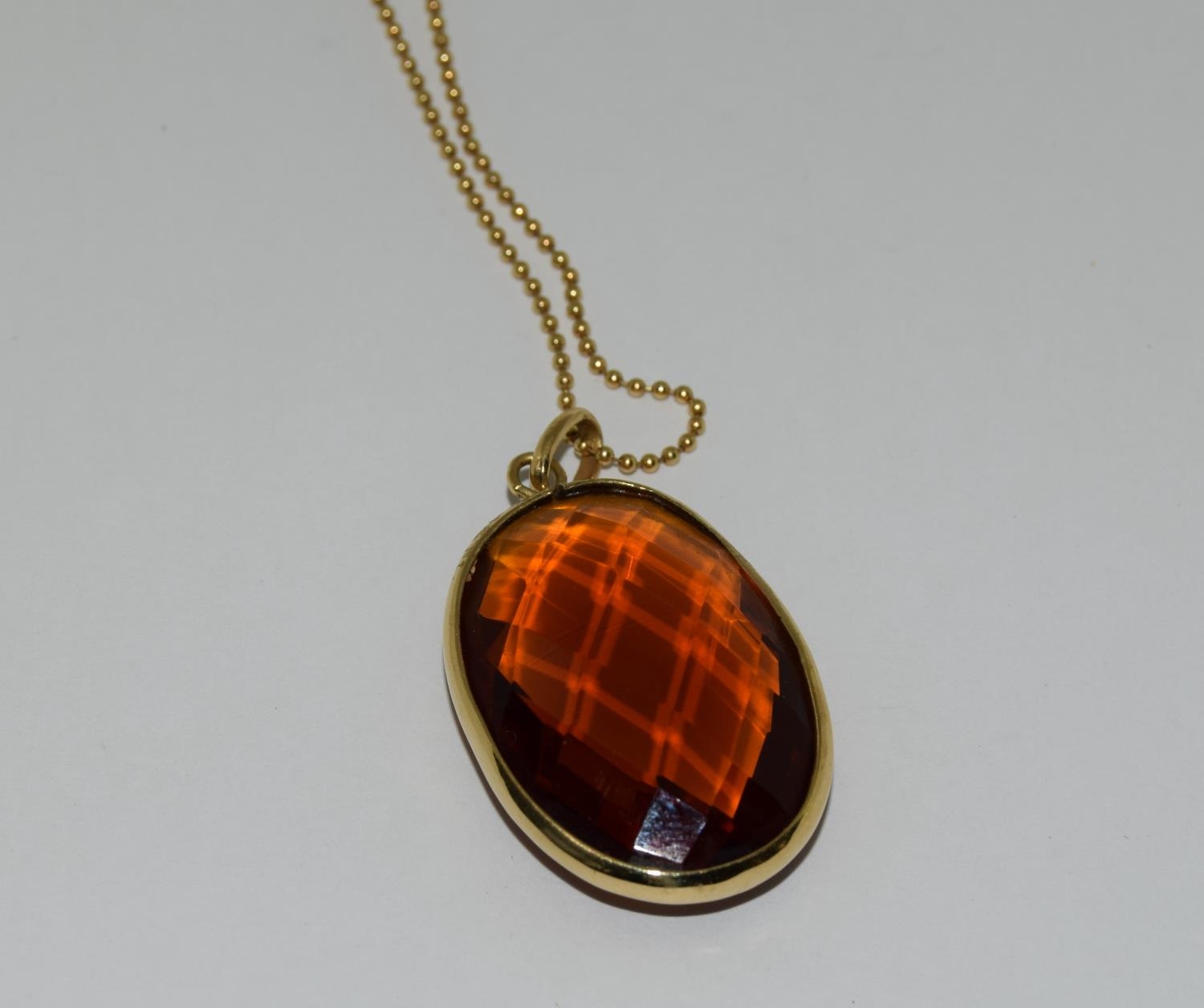 Gold amber quartz pendant necklace.