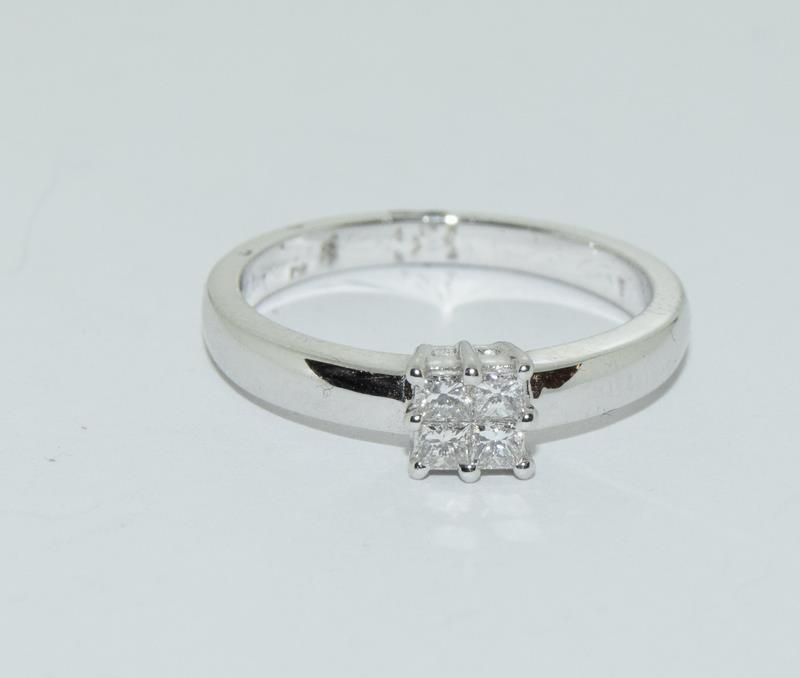 An 18ct white gold princess cut diamond ring.