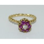 An 18ct yellow gold pink sapphire and diamond ring.