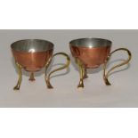 W.M.F pair of matching copper & brass Arts & Crafts egg cups on splayed brass feet with brass