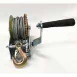 A trailer winch (ref 77)