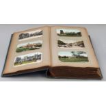 A large Victorian postcard album in excess of 500 topographical cards including local scenes.