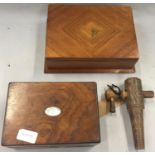 Two wooden boxes together with a tap spout.
