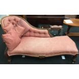 Victorian oak chaise longue upholstered in floral salmon pink buttoned back fabric with carved