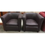 Pair of bucket back modern leather armchairs each measuring 71x77x70cm. Seat height 42cm.