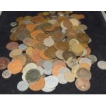 Collection of coins in a plastic tub