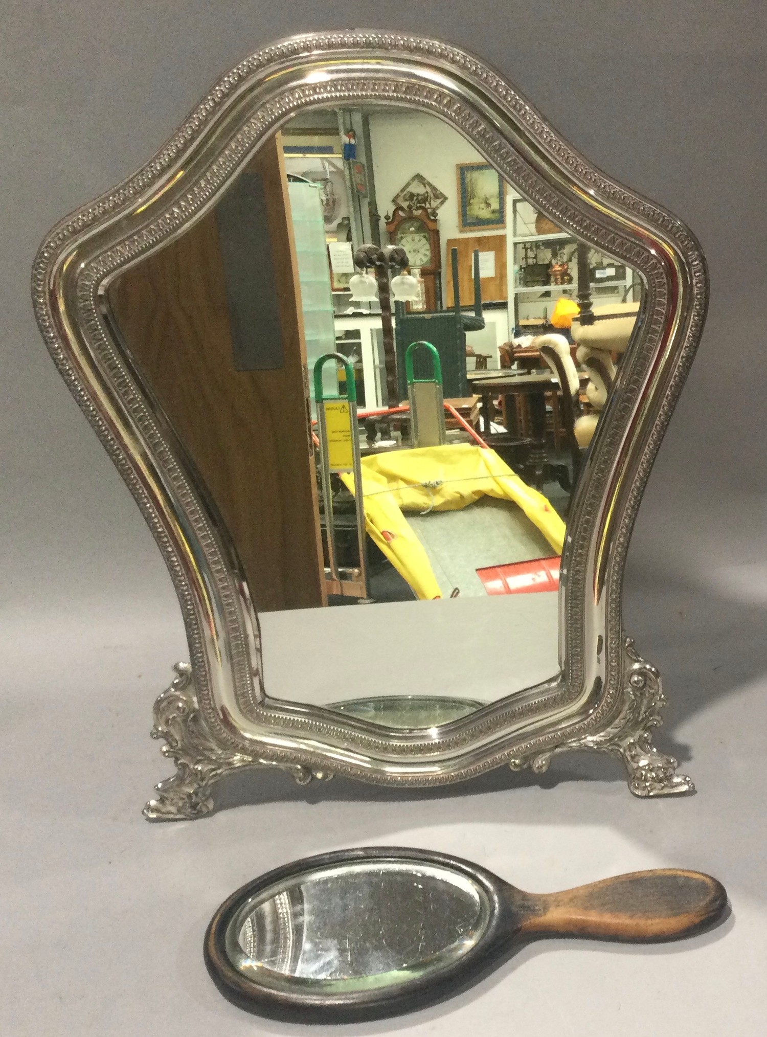 Silver hallmarked easel back dressing table mirror together with a wood backed handheld mirror.