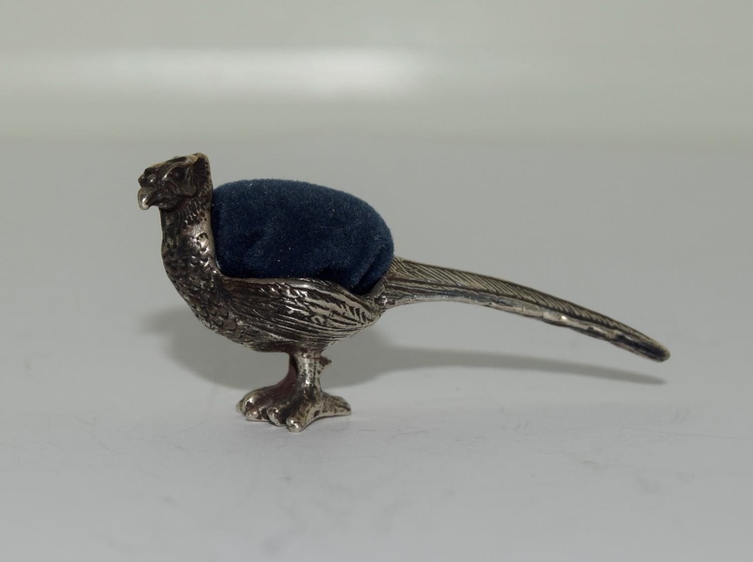 Silver pin cushion in the form of a pheasant