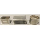 Silver hallmarked matchbox holder together with two silver hallmarked napkin rings.