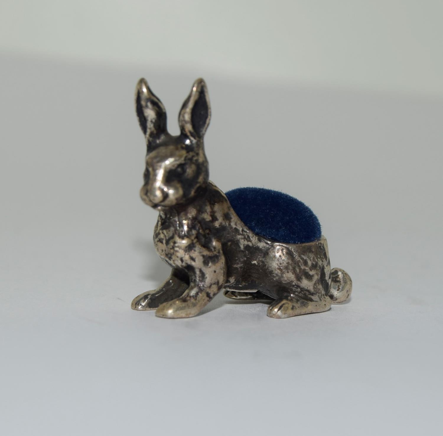 Silver pin cushion in the form of a rabbit