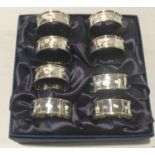 Set of eight silver hallmarked serviette/napkin rings total weight 94g.