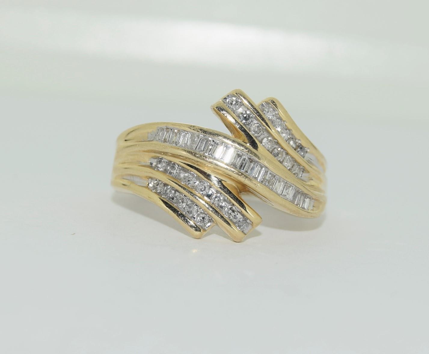 A large heavy gold and diamond swirl ring, Size U - Image 4 of 4
