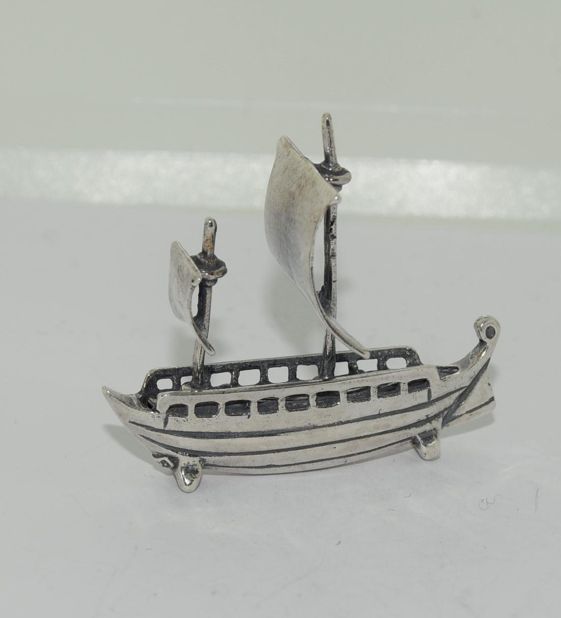 Silver figure of a sailing boat stamped 925