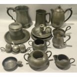 Collection of antique pewter pieces to include Quart jug, candlestick, plates and other items.