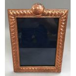 A Large copper and enamel easel back picture frame