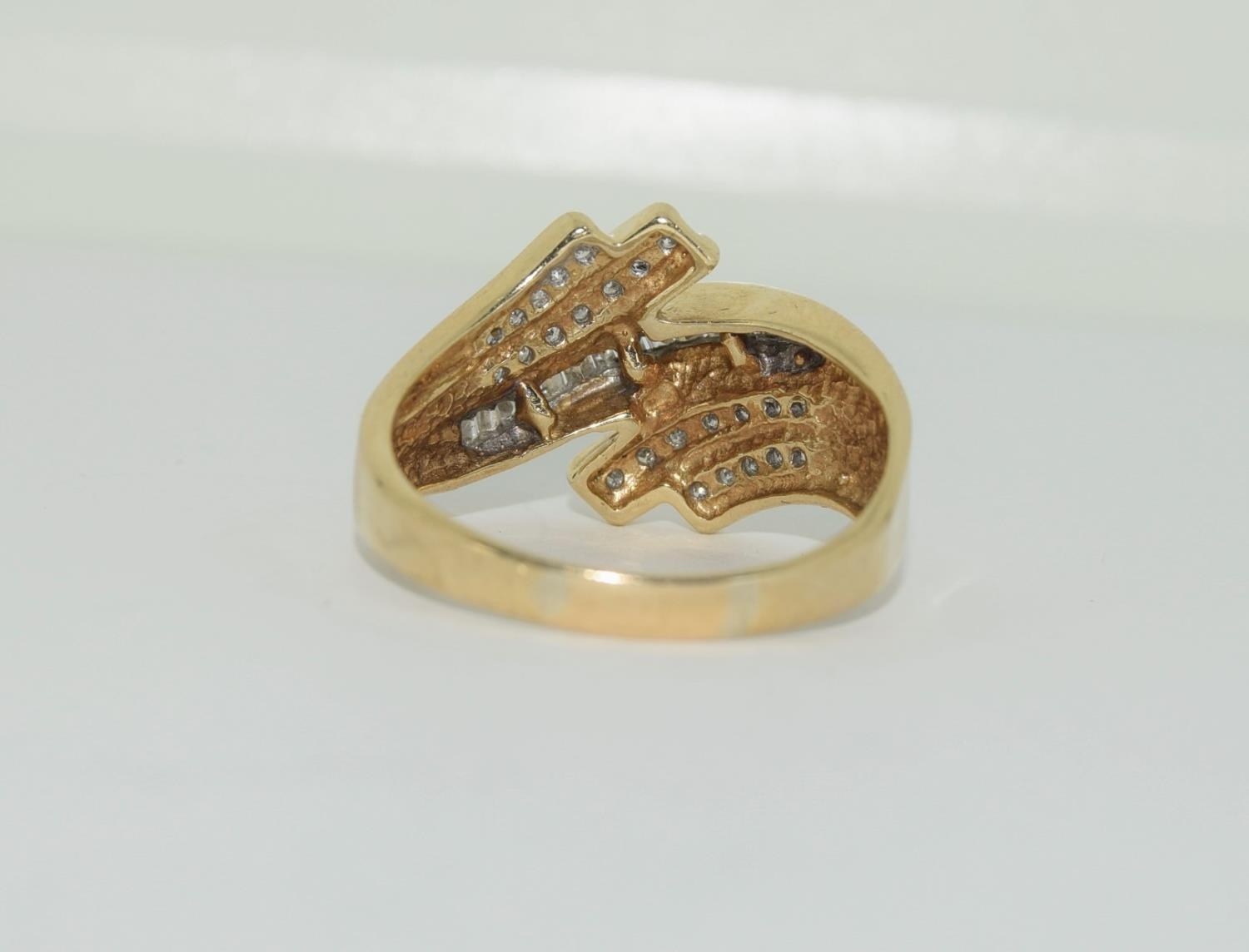 A large heavy gold and diamond swirl ring, Size U - Image 3 of 4