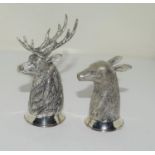 A pair of silver plated stag and doe condiments