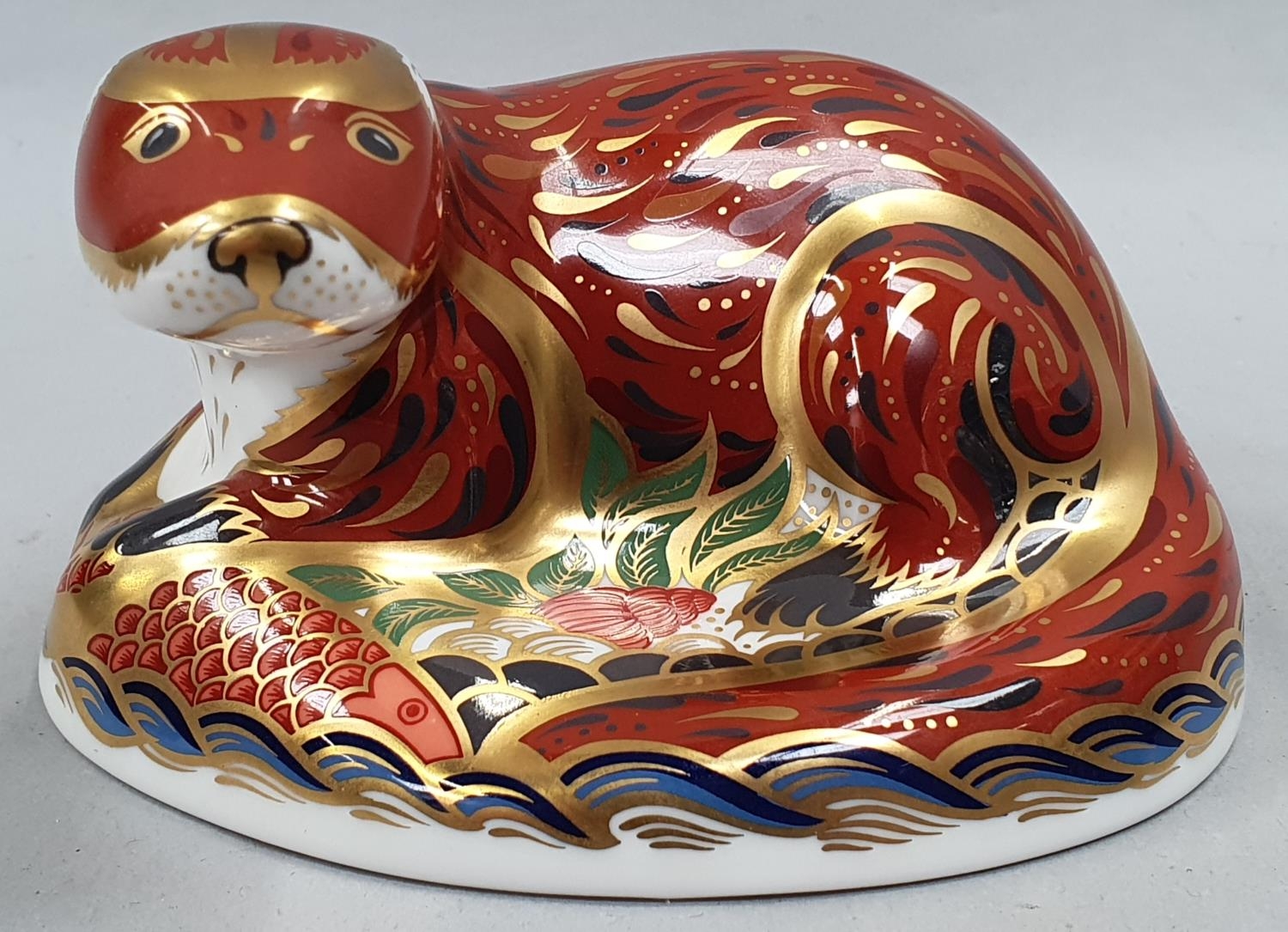 Royal Crown Derby Otter with gold stopper.