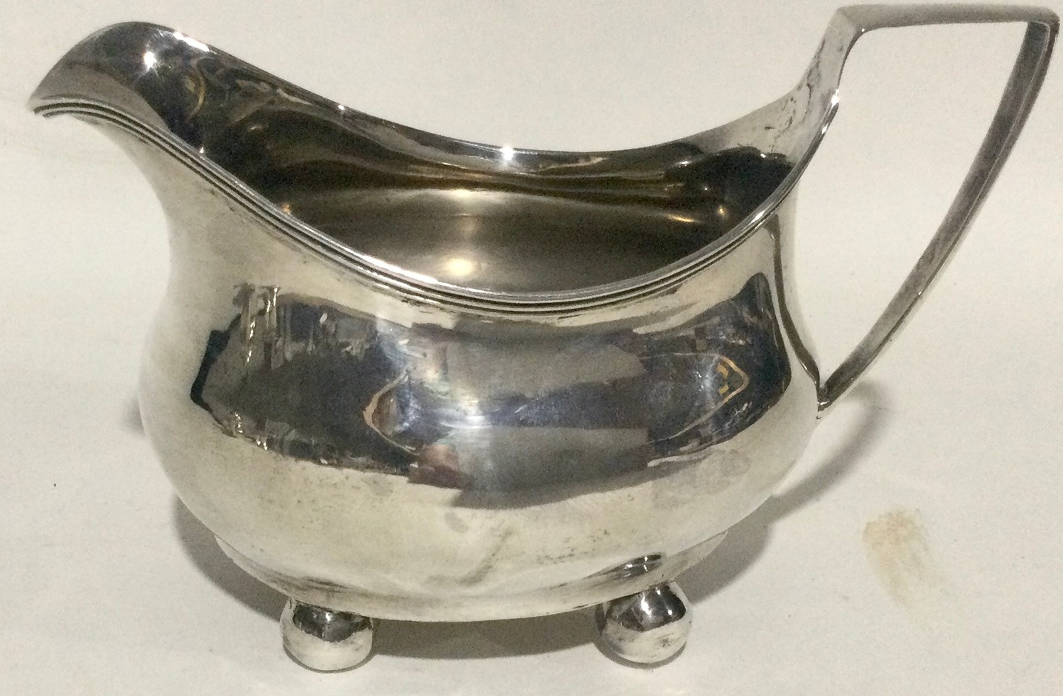 Georgian silver 4 footed milk jug 100gm