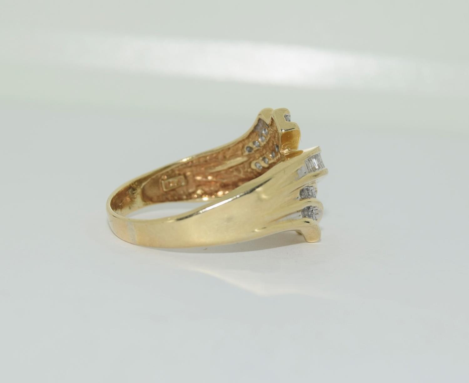 A large heavy gold and diamond swirl ring, Size U - Image 2 of 4