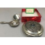 Ladies vintage 1950s silver powder compact boxed together with a small novelty powder compact in the