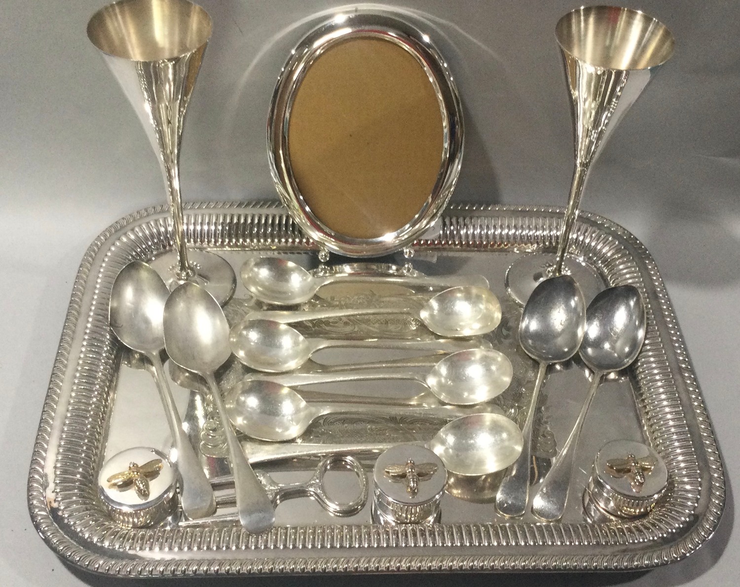 A collection of silver and silver plated items to include flatware.