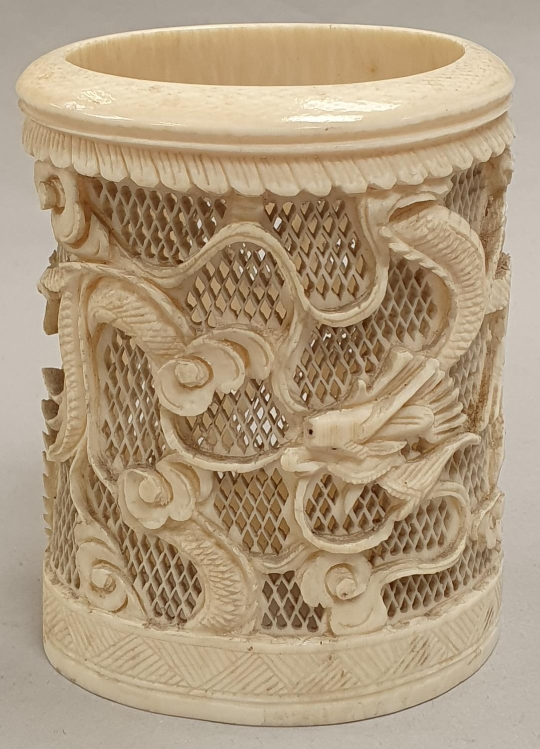 Ivory carved napkin holder.