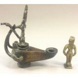 Eastern bronze oil lamp and a small bronze Benin style figure (2).