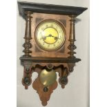 Mahogany striking wall clock with pendulum