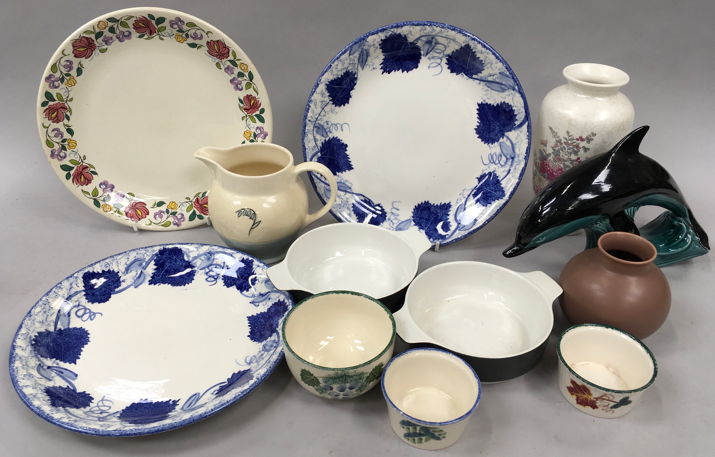 Quantity of Poole Pottery to include large blue and white plates